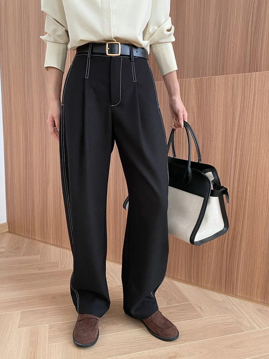 Deconstructed, split exposed outer seams, straight, loose, drapey casual pants with a yuppie vibe.