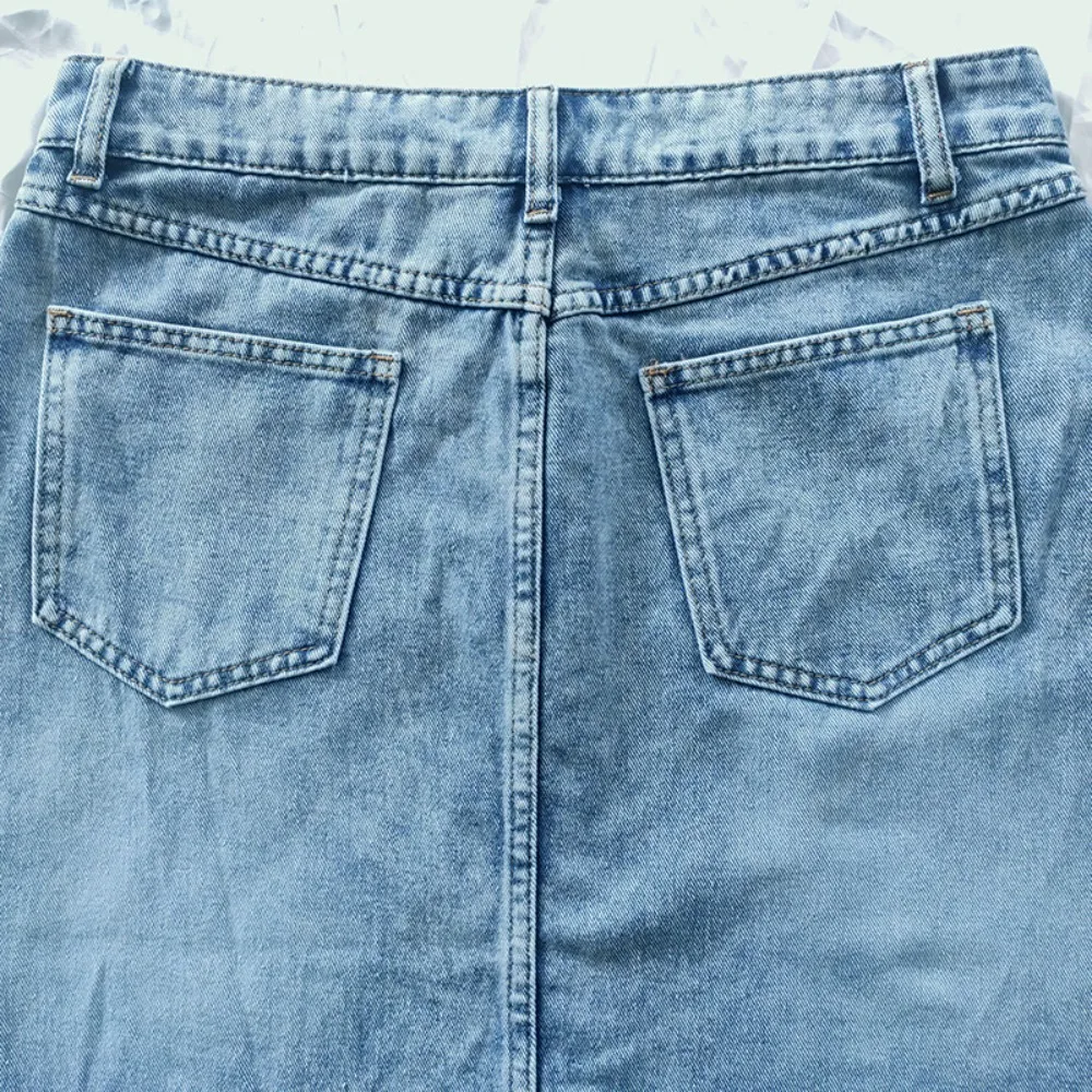 تنورة الدنيم النسائية خمر التنانير الطويلة غسلها المتعثرة عالية الخصر جيوب زر جيوب 2025 الصيف الإناث الشارع الشهير