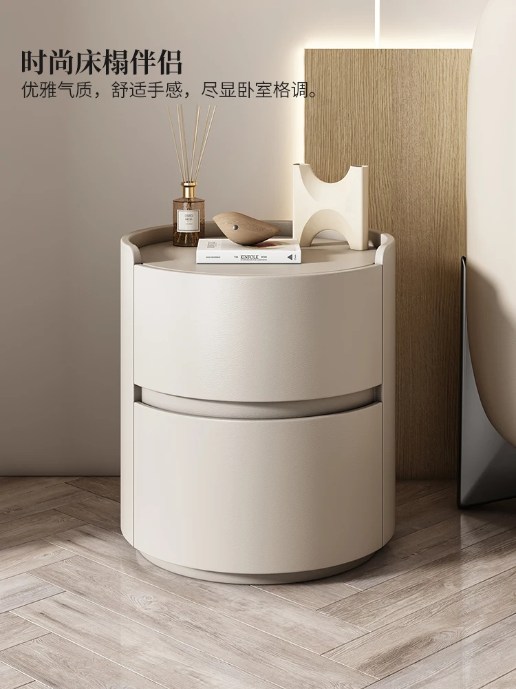 

Round bedside table 2023 cream wind Internet celebrity design size apartment bedroom bedside table