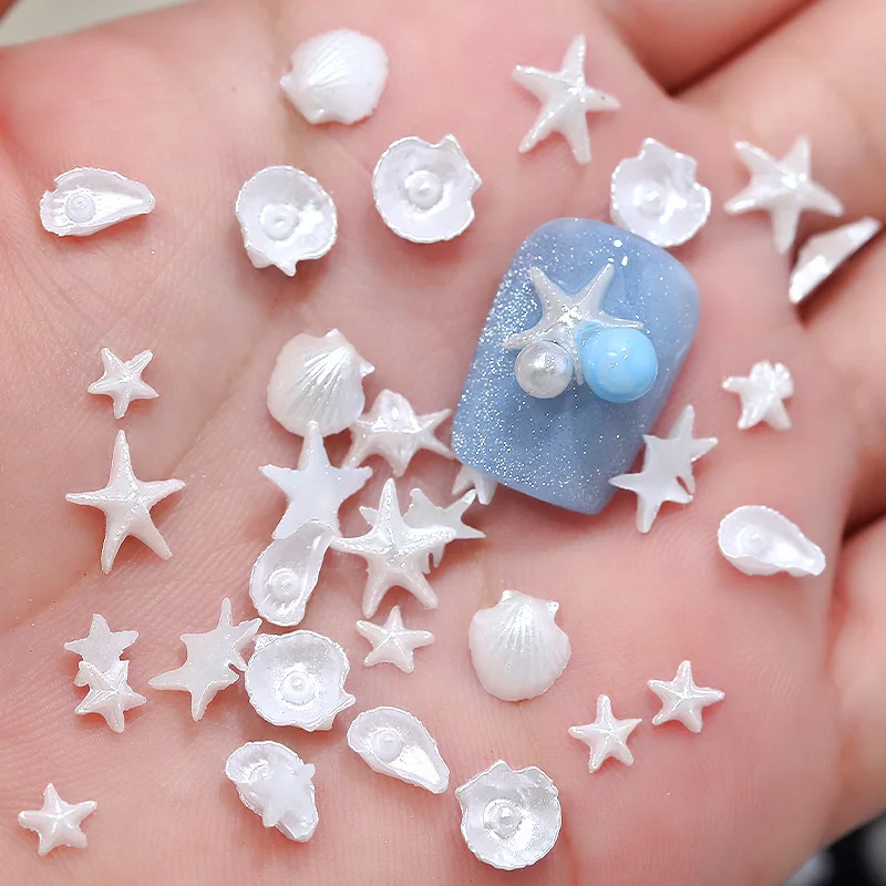 50 ชิ้น ของตกแต่งเล็บเรซิ่นรูปปลาดาวเปลือกหอยมุกสีขาวมุกประกาย น่ารัก สไตล์โอเชียน สำหรับตกแต่งเล็บ