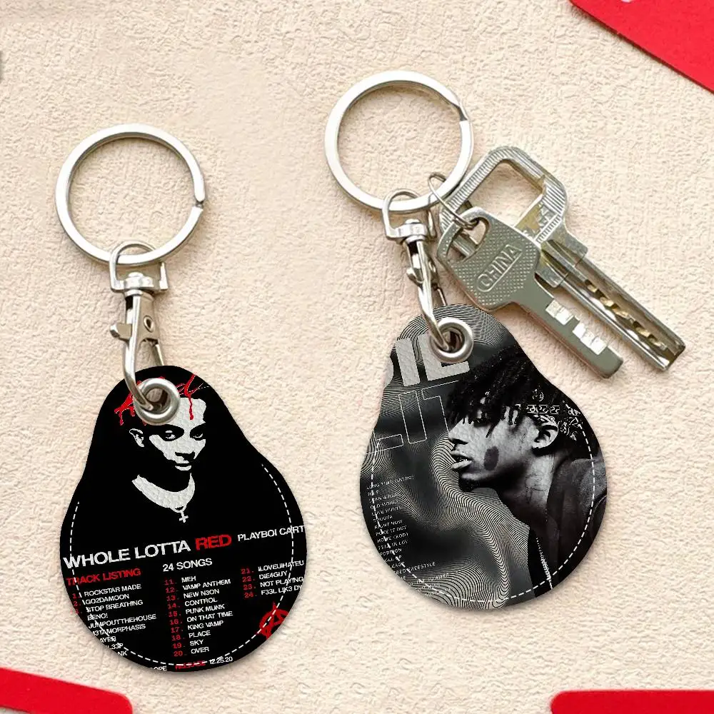 مغني الراب P-Playboi C-CartiS سلاسل المفاتيح المستديرة للنساء بولي Leather الجلود الفراغات حلقات المفاتيح مثالية لهدايا العيد ومفضلات الحفلات