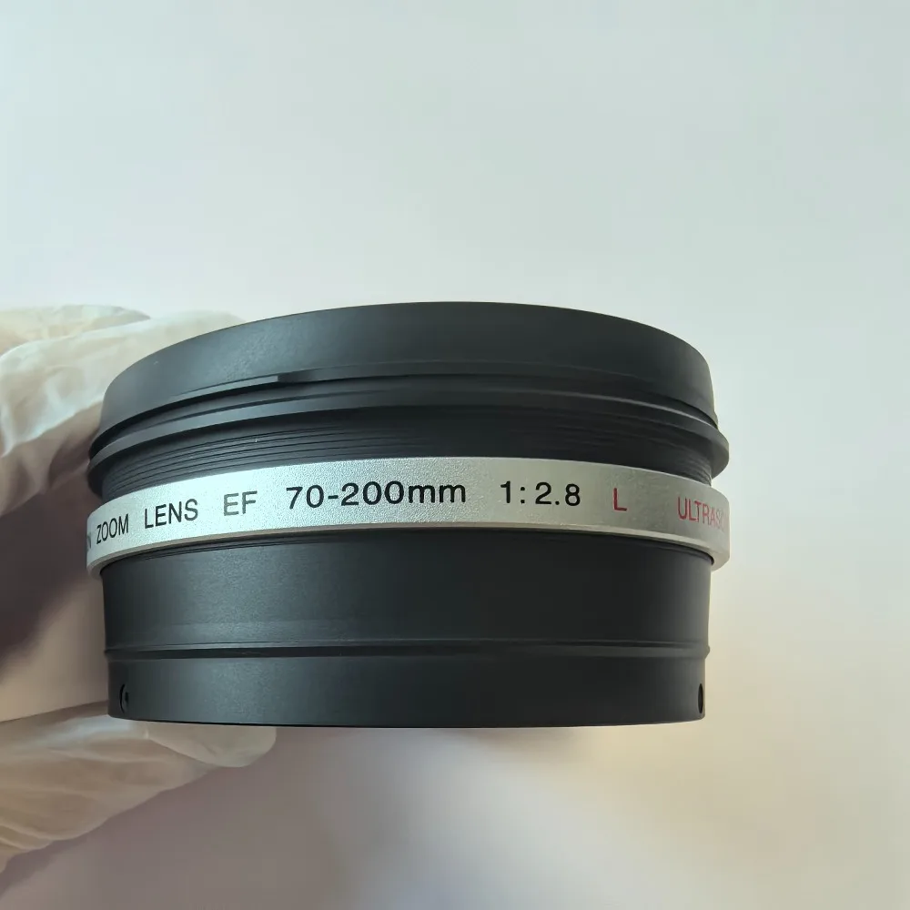 

Для объектива Canon ZOOM LENS EF 70-200mm 1:2.8 L USM, калибр 77 мм, 70-200 F2.8, 1-е поколение, переднее кольцо UV-фильтра, цилиндрический корпус, крепление на трубку объектива