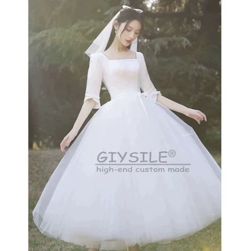 ชุดแต่งงานสีขาวแบบสั่งตัดของ GIYSILE ปี 2026 คอเหลี่ยมสไตล์เฮปเบิร์น สายรัดหลังแบบแฟชั่น กระโปรงฟูฟ่องแบบเจ้าหญิง