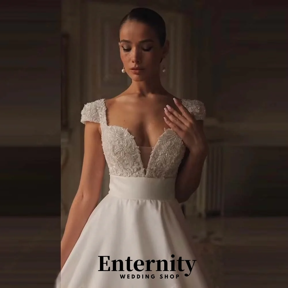 Maßgeschneidertes exquisites Kurzarm-Hochzeitskleid Charmantes V-Ausschnitt Sweep Zug Brautkleider Pailletten Brautkleid Vestidos De Noiva