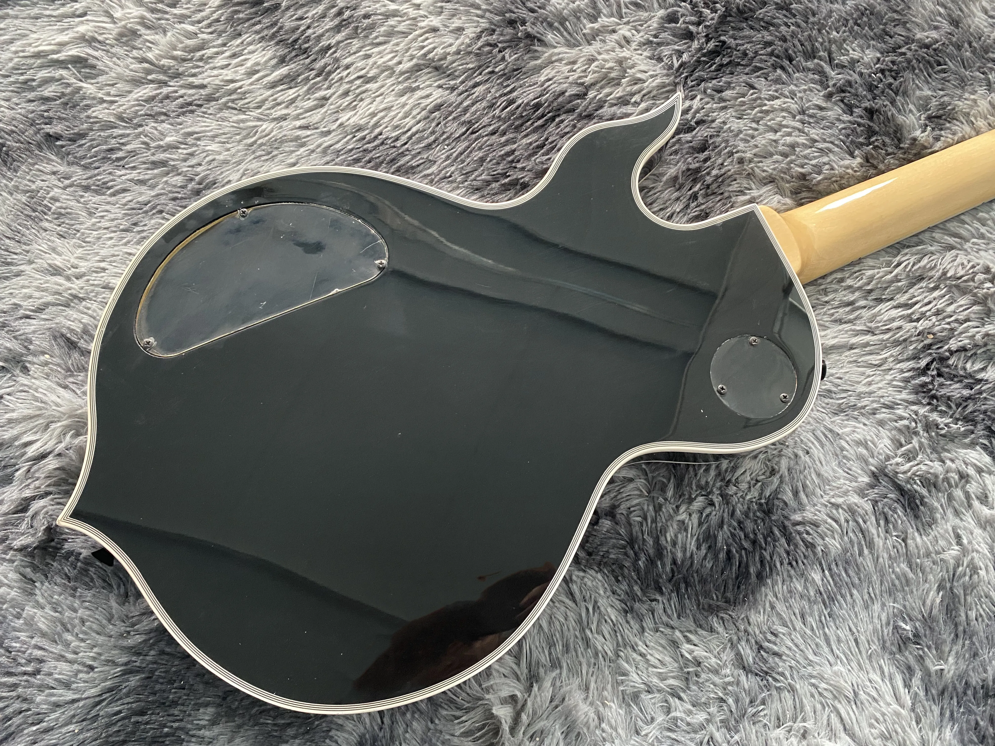 China electric guitar Black yellow circle Black psychedelic circle Factory direct sales can be customized Free shipping