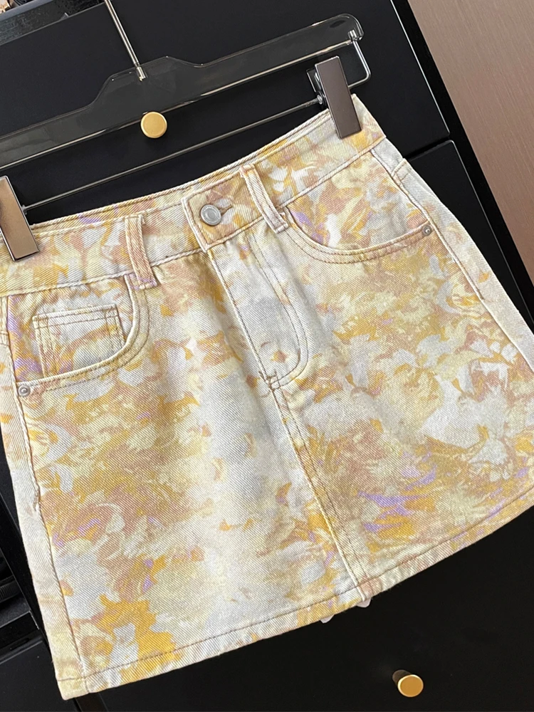 Novo coreano tie dye pintura a óleo impressão cintura alta a linha emagrecimento temperamento versátil meio corpo denim saia curta 2025