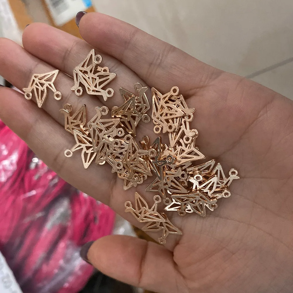 

100pcs Hollow Thousand Paper Crane Pendant Alloy Creative Key Chain Bracelet Earring Hanging Decorative Accessories Jewelry