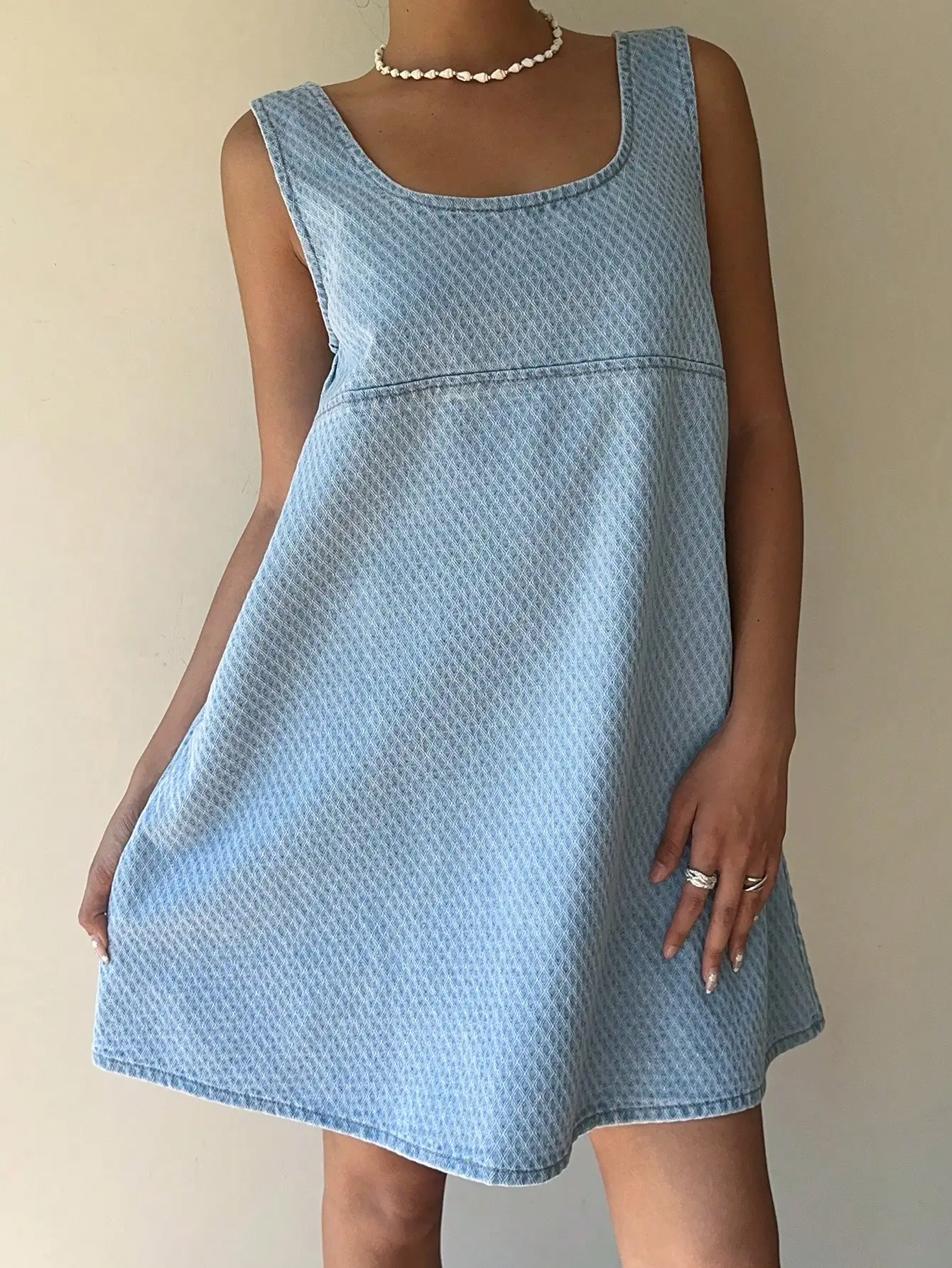 

Korean style slimming sleeveless denim dress with a round neck and loose fit for summer featuring a stylish A-line backless den