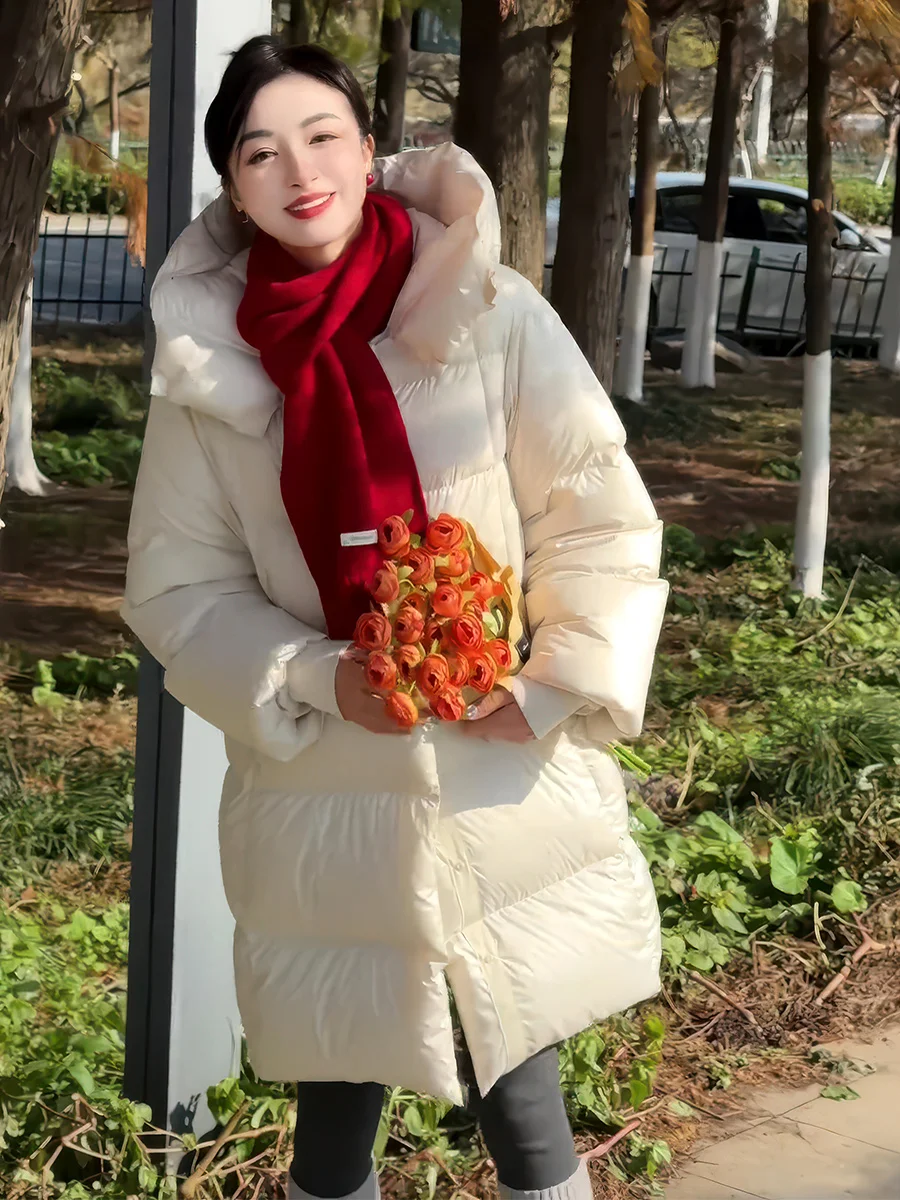 เสื้อพัฟเฟอร์มีฮู้ดสไตล์เกาหลี ความยาวปานกลาง สำหรับผู้หญิง รุ่นใหม่ปี 2025 ทรงหลวม ช่วยให้ดูผอม สีขาว บุด้วยขนเป็ด ให้ความอบอุ่น