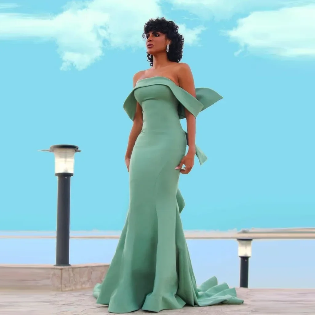 Elegancka suknia balowa Sage, bez ramiączek, krój syreny, odkryte ramiona, suknia balowa high couture, kokarda na plecach, długi tren, suknie maxi szyte na miarę.