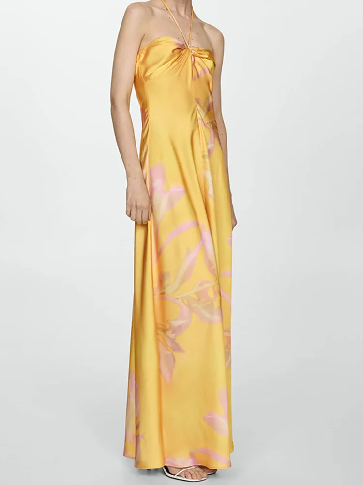 2025年夏新作 イエロー プリント サテンワンピース ノースリーブ ハンギングネック バックレス ロングスカート セクシー スタイル ファッションと快適さを兼ね備えたドレス