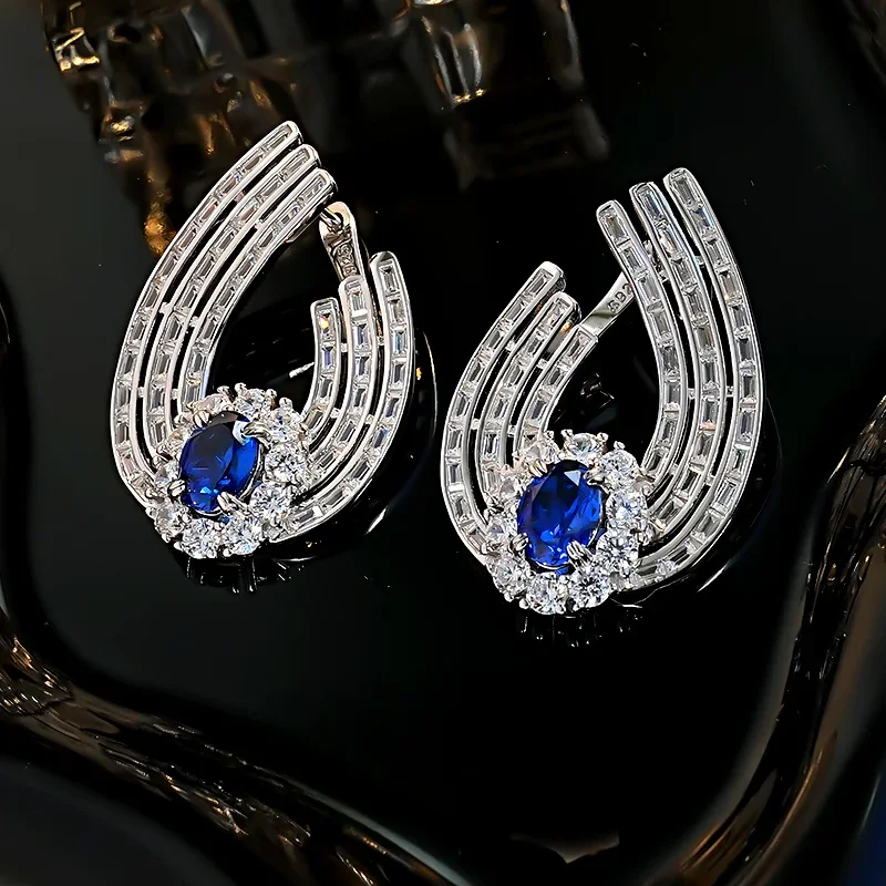 European and American style sparkling galaxy track inlaid emerald colored treasure earrings s925 silver ear buckle personality