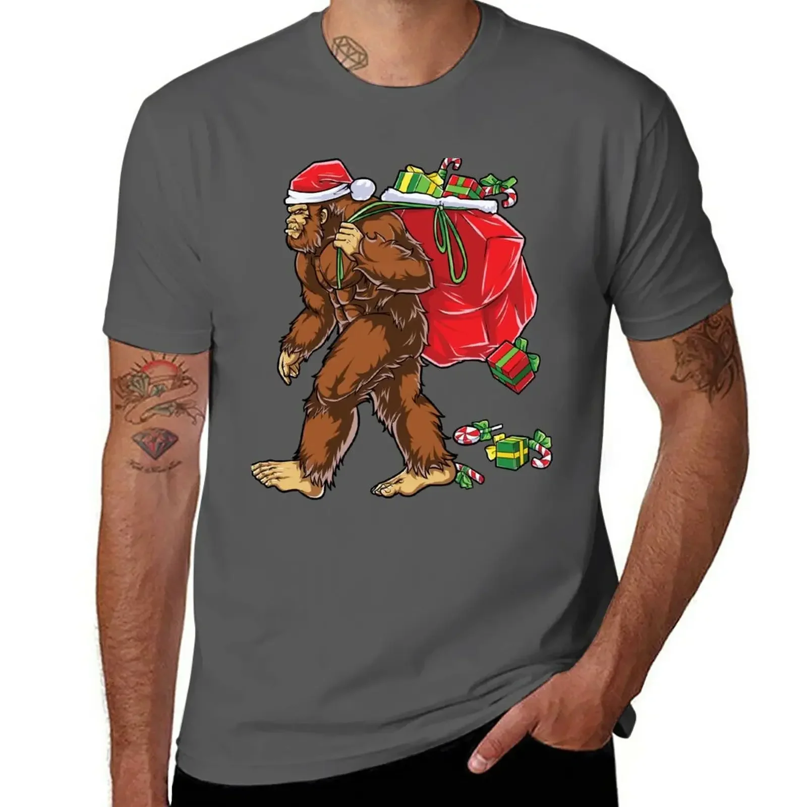 

Bigfoot Santa T Shirt Hat Carrying Christmas Bag Sasquatch T-Shirt cute tops kawaii clothes cute clothes mens shirts graphic tee