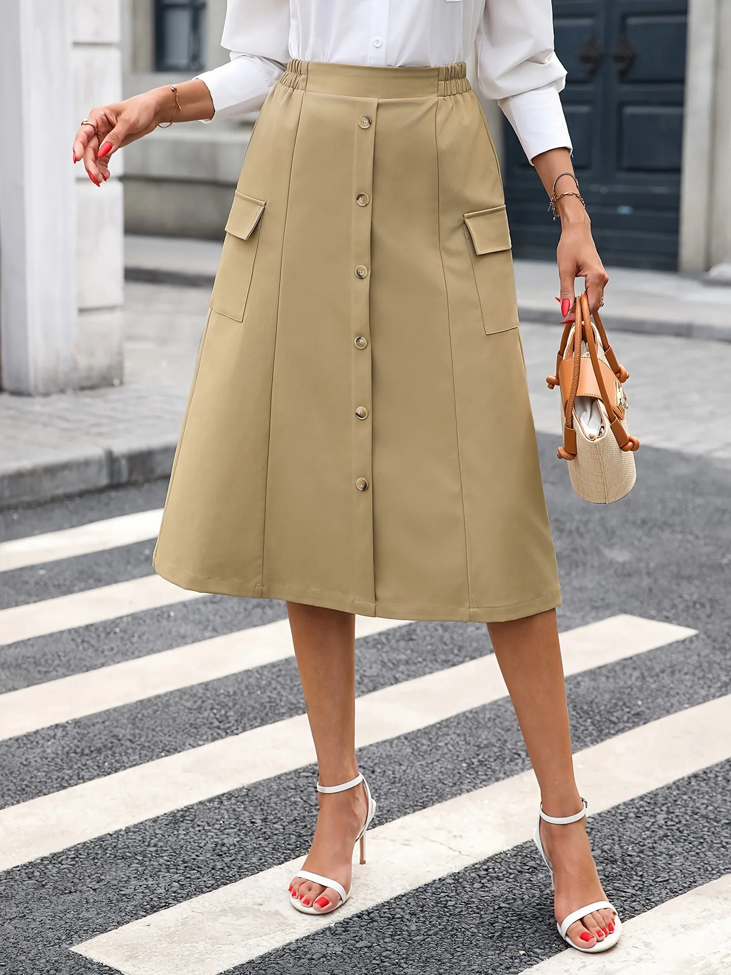 Autunno nuovo colore solido a vita alta decorazione con bottoni gonna a tubo dritto con design a tasca grande gonna casual alla moda da donna