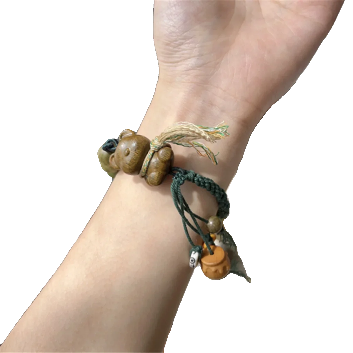 Green sandalwood bib teddy bear bracelet paired with green sandalwood round bead roots and Adai sandalwood honey jar