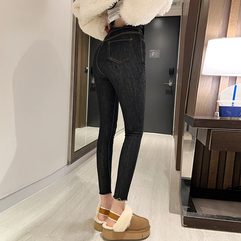 بنطلون جينز نسائي عالي الخصر بتصميم أزرار مائلة، مرن، بنمط قلم رصاص، أنيق وعصري لفصلي الخريف والشتاء، بلون واحد، طول تسعة أرباع