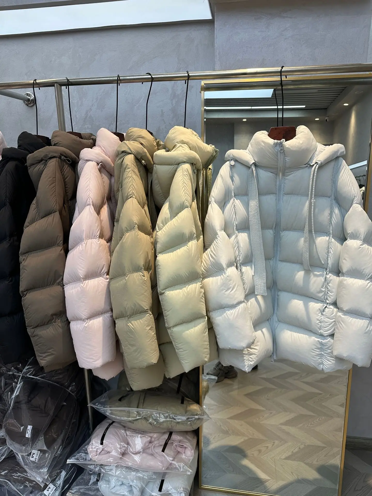 

Detachable Hooded Women Puffer Coat with Ribbons Windproof & Heat-Retaining Mid-Long Loose Winter Down Jackets