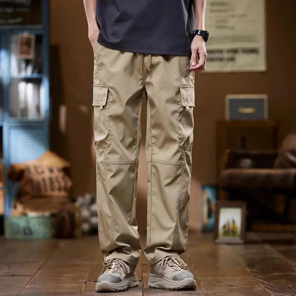 Pantalones de diseño ergonómico para hombre, estilo Vintage de calle alta, Cargo con cordón en la cintura, múltiples bolsillos para viajes al aire libre