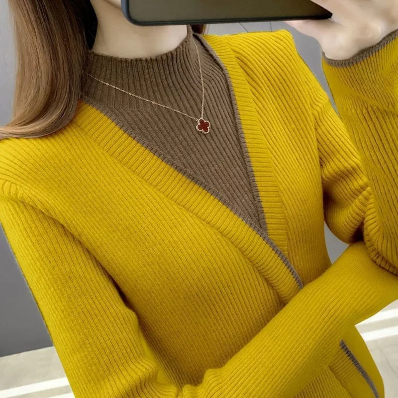 Moda medio cuello alto empalmado falso dos piezas suéteres ropa de mujer 2022 otoño nuevos suéteres sueltos de viaje Casual Tops
