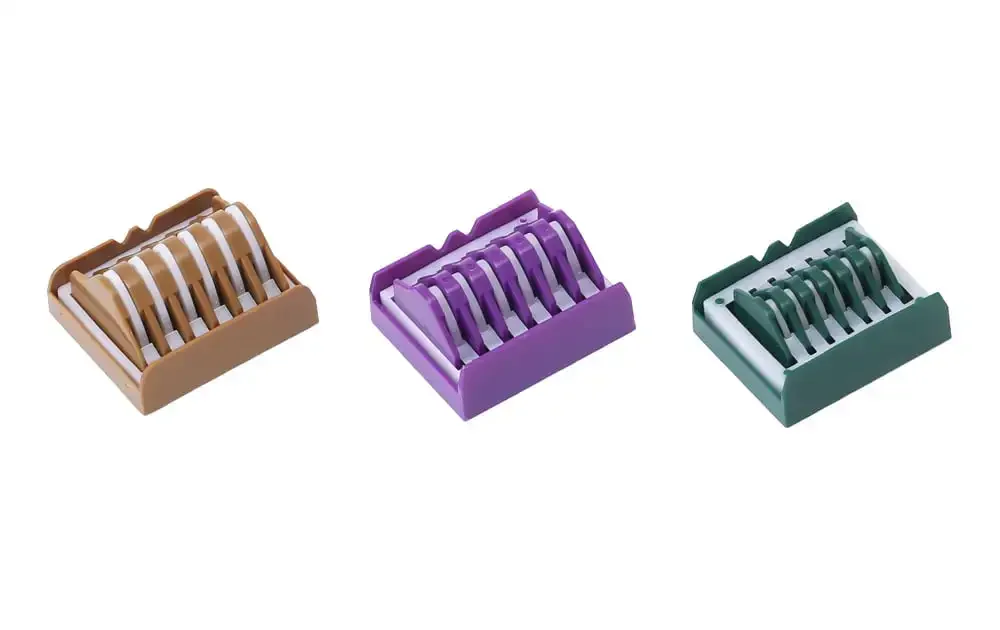 Three sizes of polymer ligature clips, surgical  Hemilok  laparoscopy