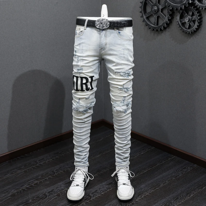 

Fashionable new men's jeans, washed with water, nostalgic stretch, slim fit, retro light blue, perforated white patch, denim, hi