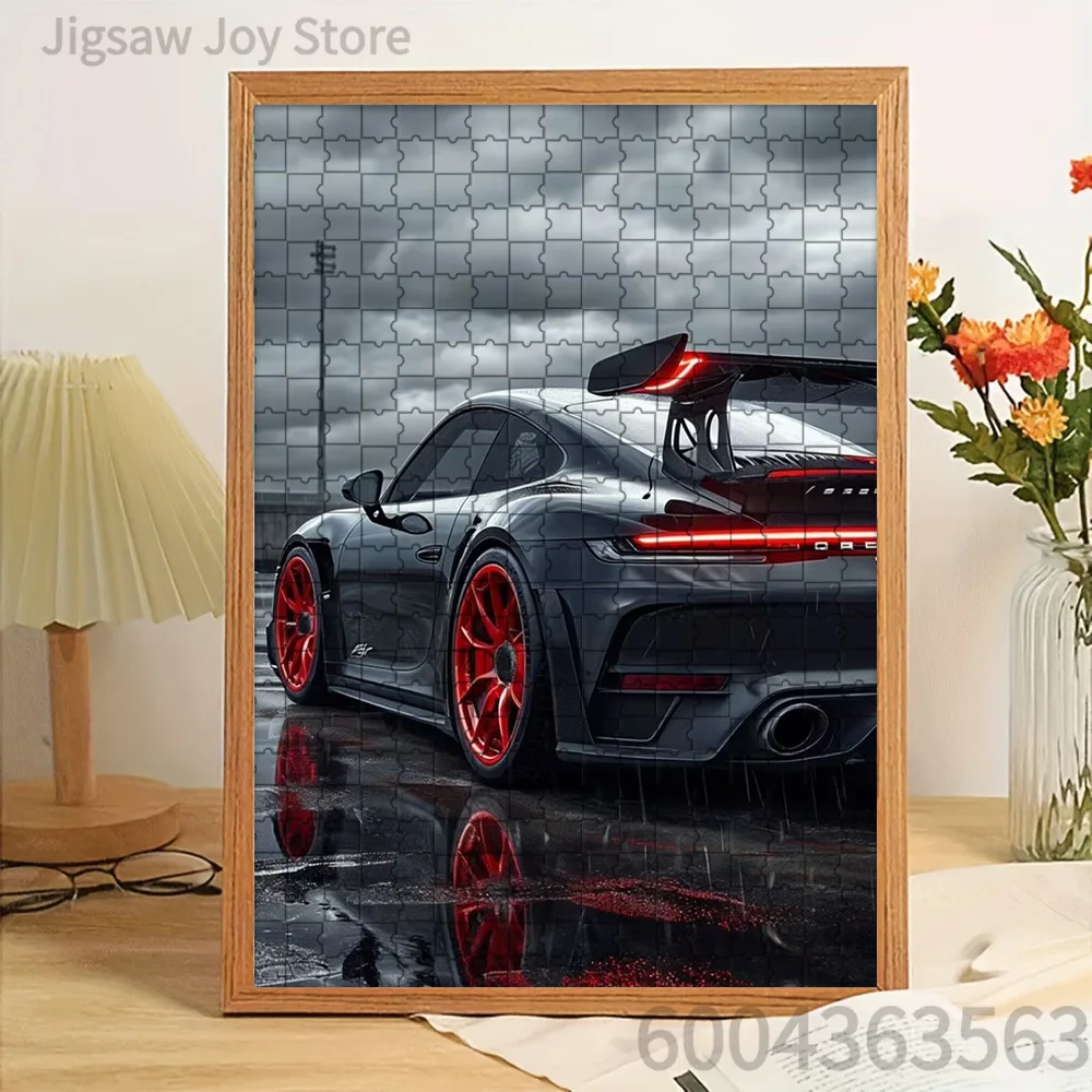 

Paper Jigsaw Puzzle Dark Grey Porsche 911 GT3 with Red Wheels on Wet Reflective Asphalt Under Stormy Sky Artwork Brain Teaser