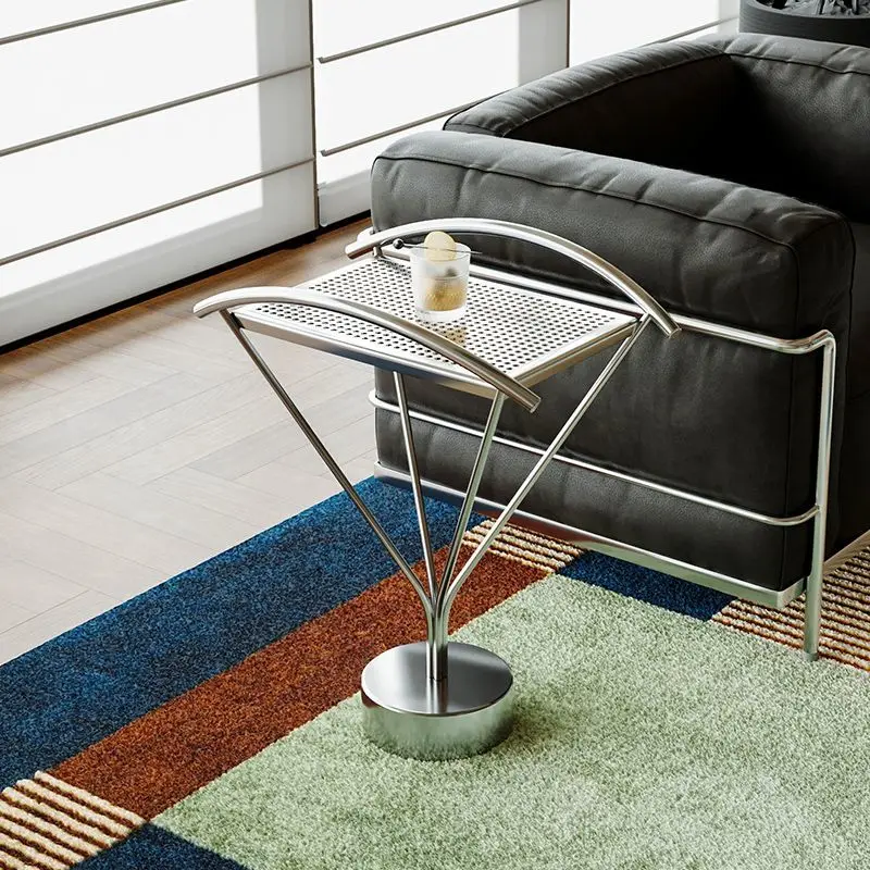 

teel small side villa, living room light luxury and high-end sense, small coffee table simple, creative sofa side table