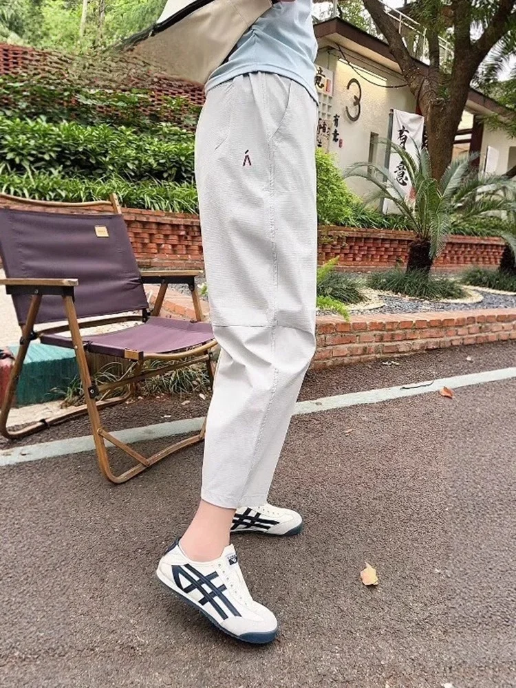 

Женские повседневные брюки Qui Dry Spor: свободные, зауженные, с высокой талией, укороченные, из ледяного шелка, летние, из смеси полиэстера и спандекса