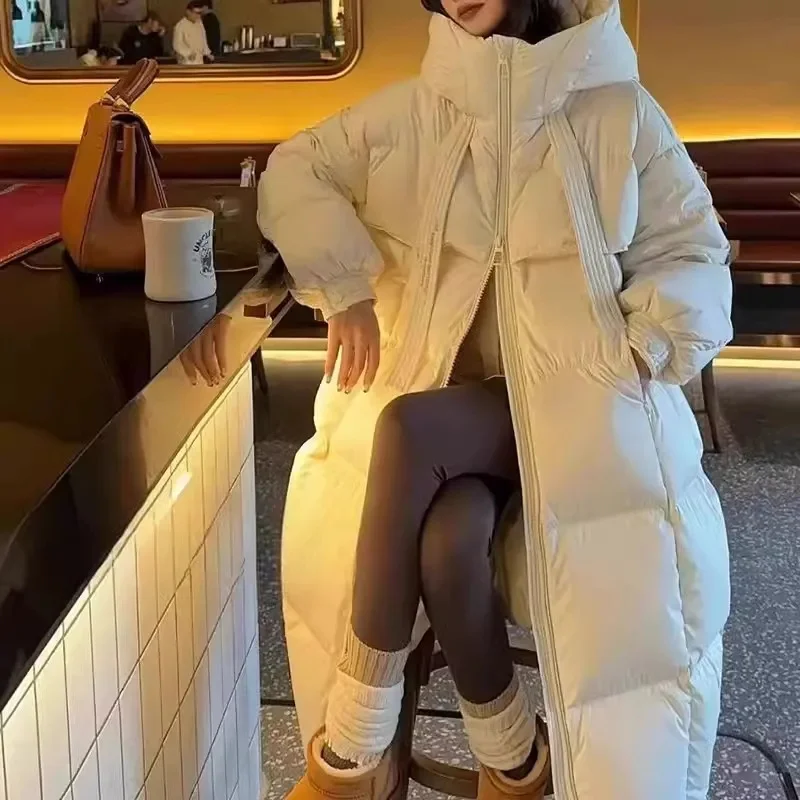2025 Nuova giacca invernale in cotone Cappotto lungo da donna Edizione coreana Giacche larghe e spesse con cappuccio Cappotto Parker caldo femminile