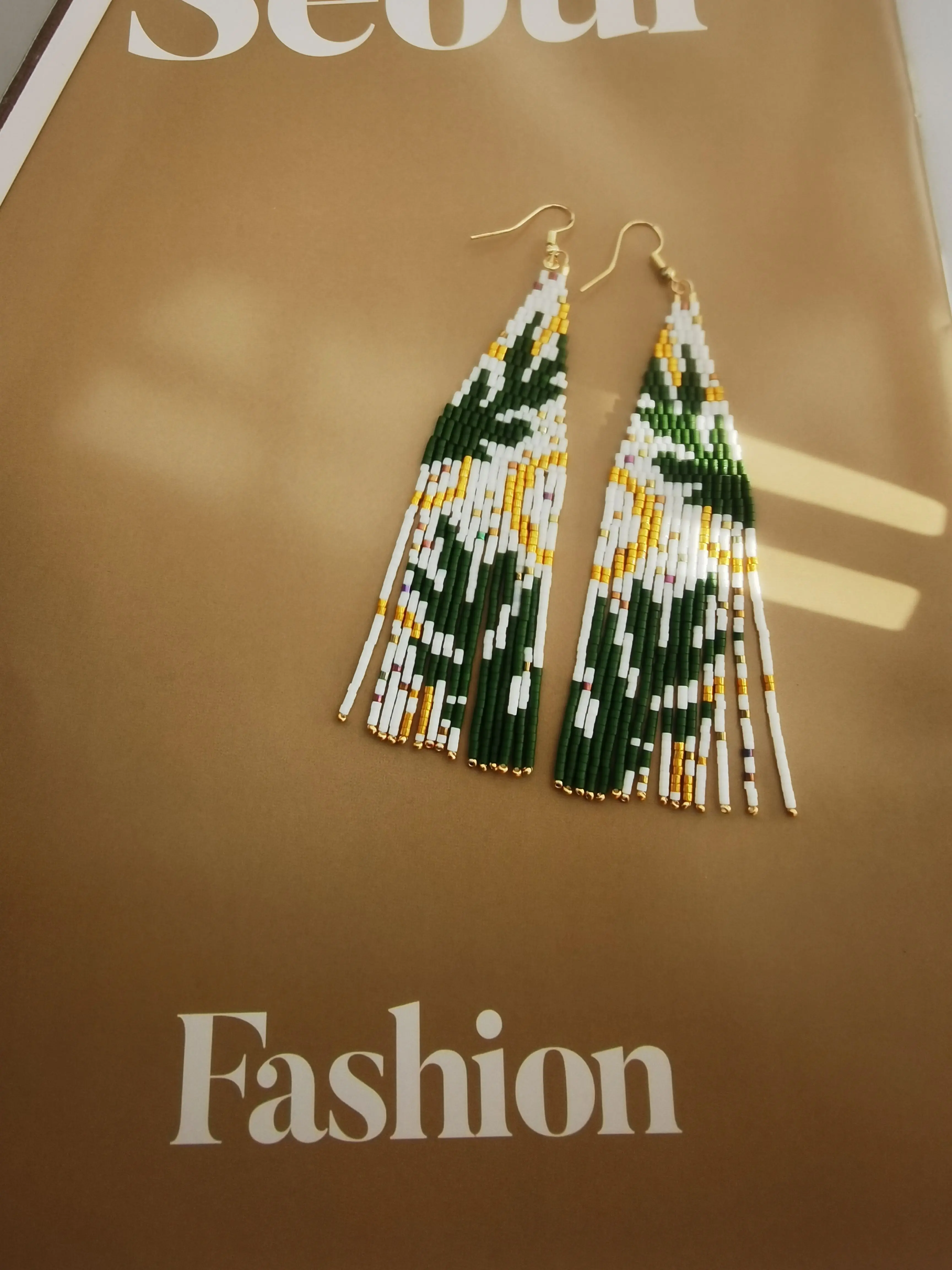 

Beaded earrings Tassel leaf Design Hand knitting Originality Tide Bohemia Alloy Versatile Female Simple Rice bead earrings