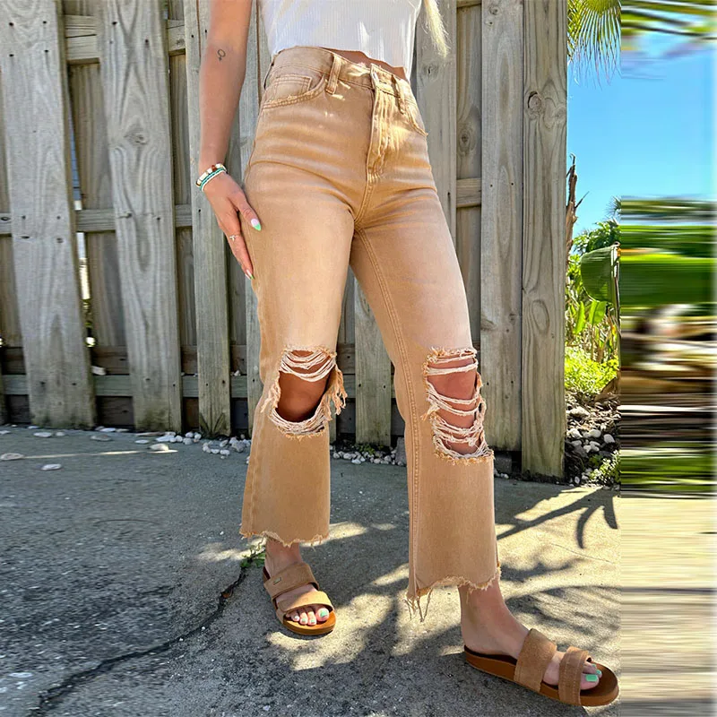 Damskie podarte jeansy casualowe, obcisłe, elastyczne, z guzikami, kieszeniami i modelującym krojem.