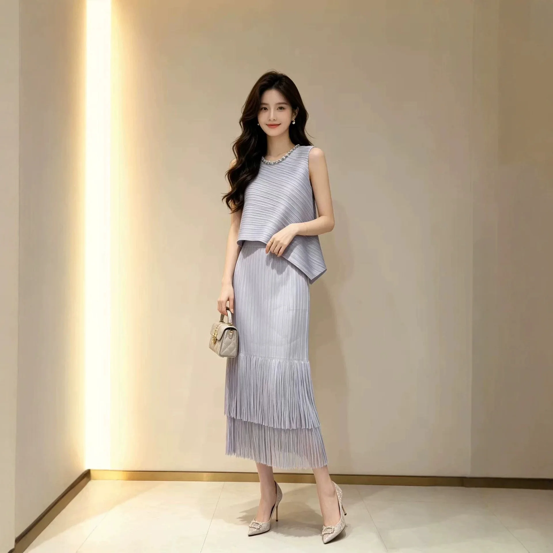 

Miyake Pleated Women's Suit 2026 New Japanese Design Loose Round Neck Sleeveless Top + Tassel Skirt Two-piece Set