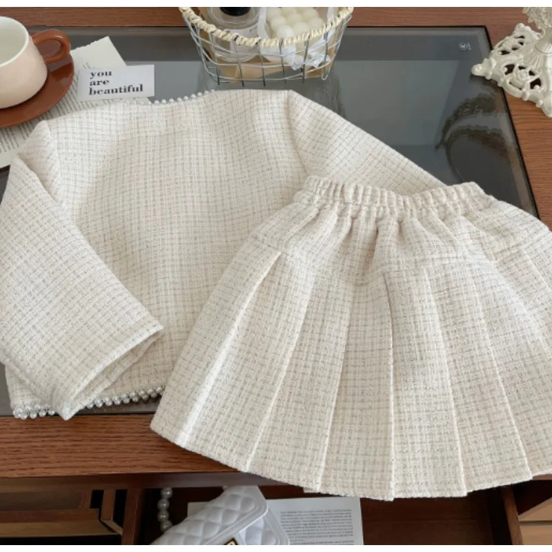 

Весенне-осенний комплект для девочек в корейском стиле, модный и элегантный, в стиле «маленький аромат», состоящий из двух предметов: топ и плиссированная юбка.