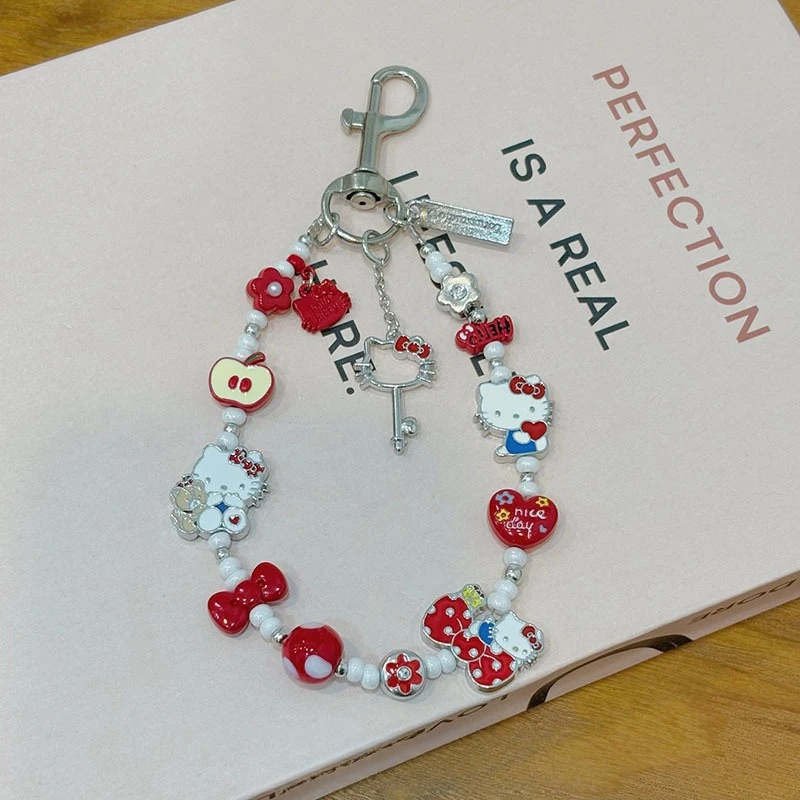 

The New Hot-selling Cute Cartoon KT Cat Mobile Phone Pendant Fashion Love Bow Apple Key Bag Pendant Is Small and Exquisite