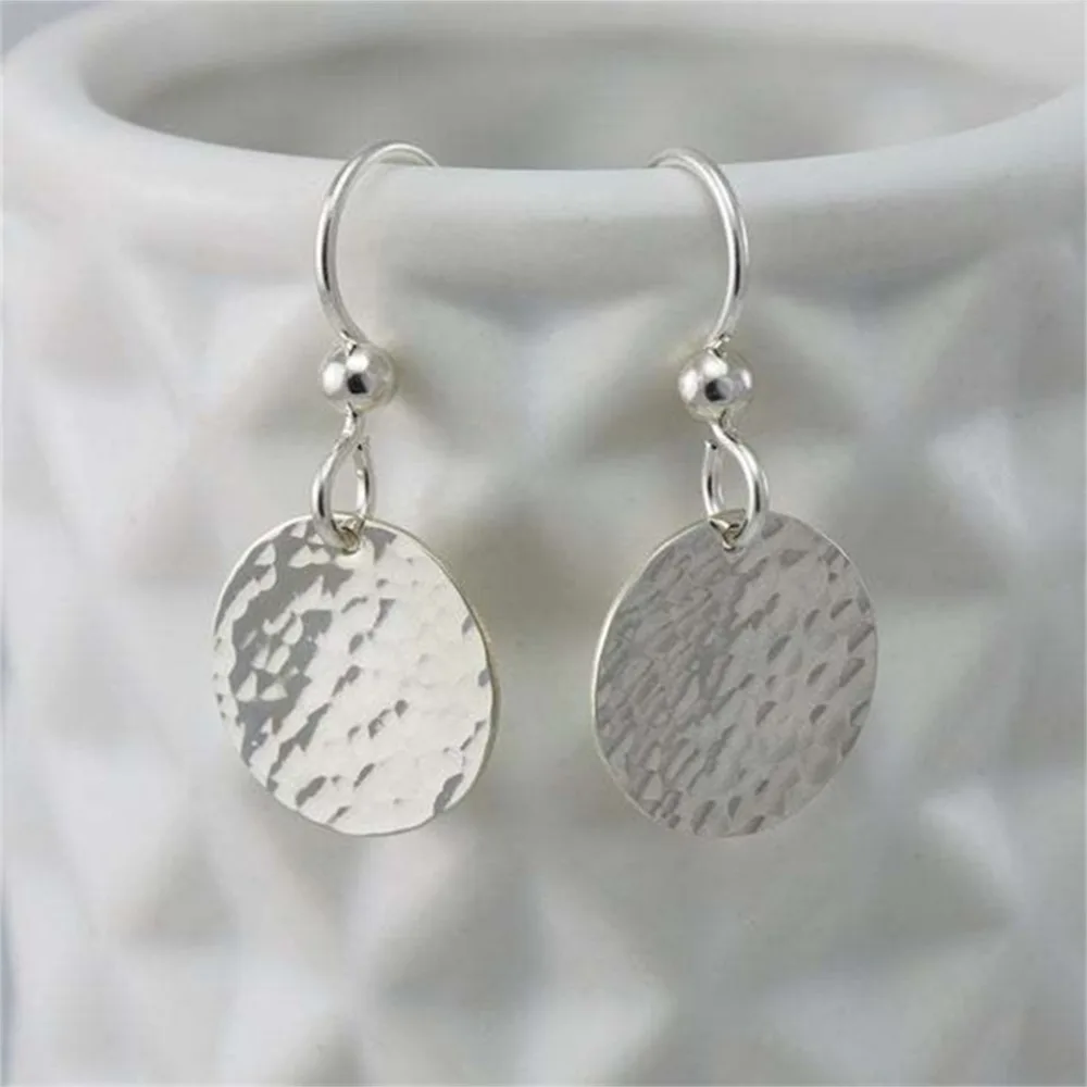 Minimalist metal concave convex small round earrings with feminine temperament, geometric striking circular accessories