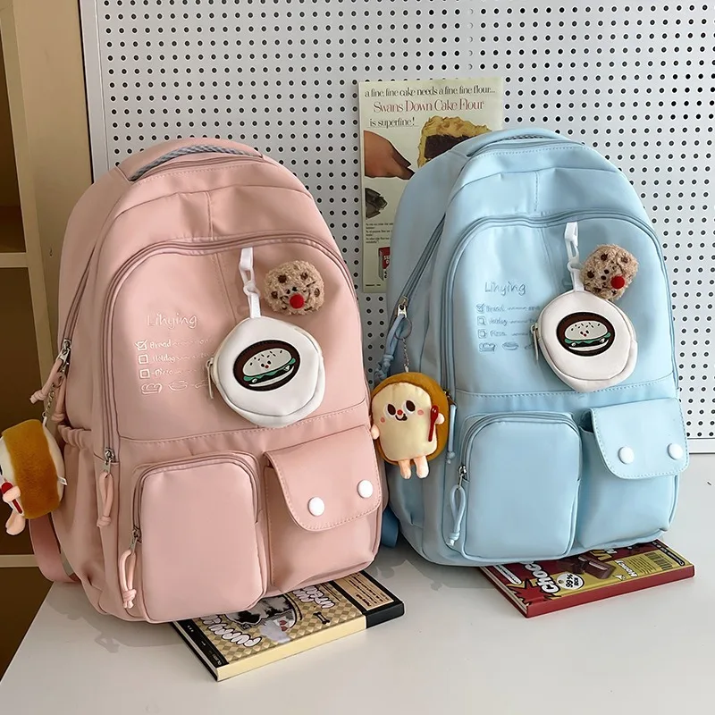 Mochila escolar Kawaii para estudiantes universitarios, morral de viaje ligero de gran capacidad con bonito colgante para adolescentes