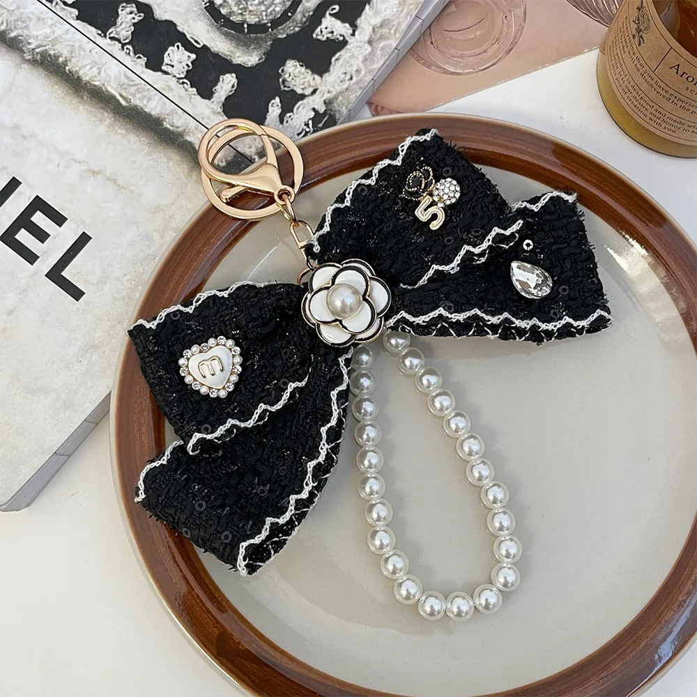 2025 المرأة القماش Bowknot سلاسل المفاتيح حزام Keyrings سيارة مفتاح سلسلة حقيبة العرافة الحلي الإبداعية حلقة رئيسية مجوهرات الأزياء