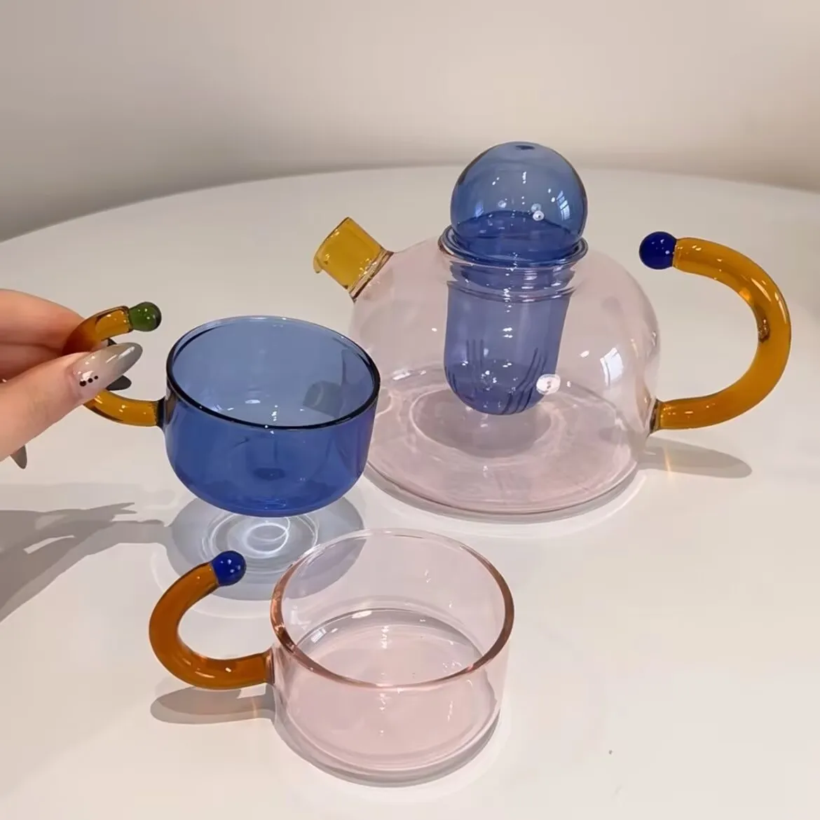 

Color Contrast High Temperature Resistant Glass Tea Water Separation and Filtration Small Teapot Home Cooking Teapot