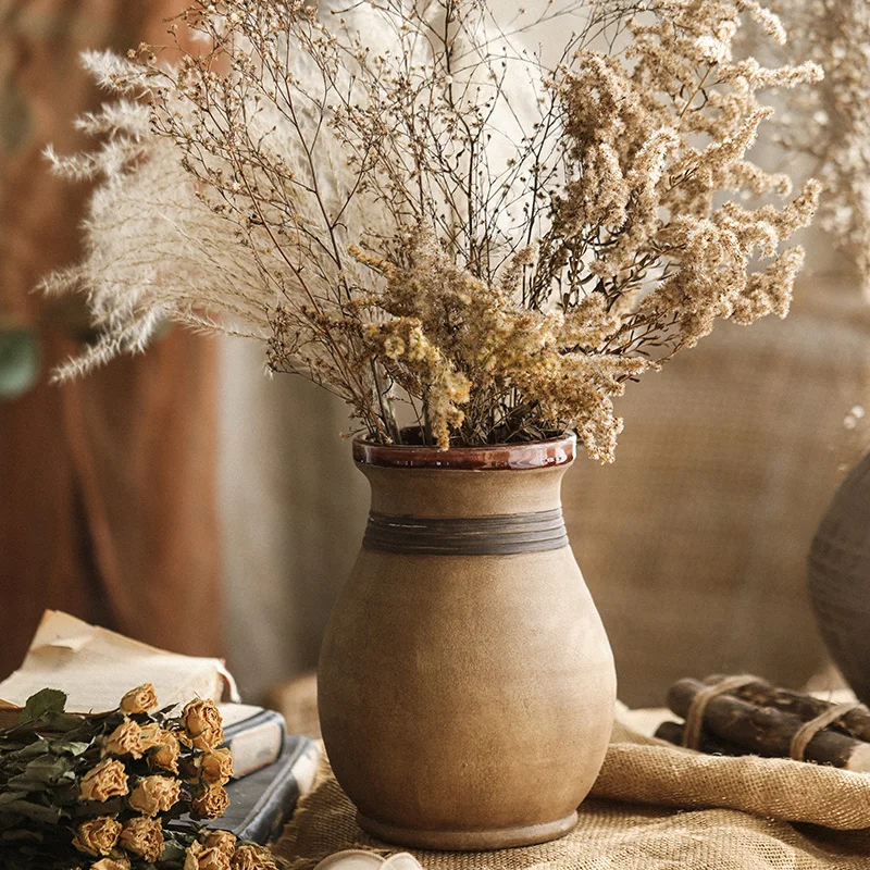 Vintage distressed stoneware vase ornaments, yellow wabi-sabi style homestay, living room, dried flowers, flower