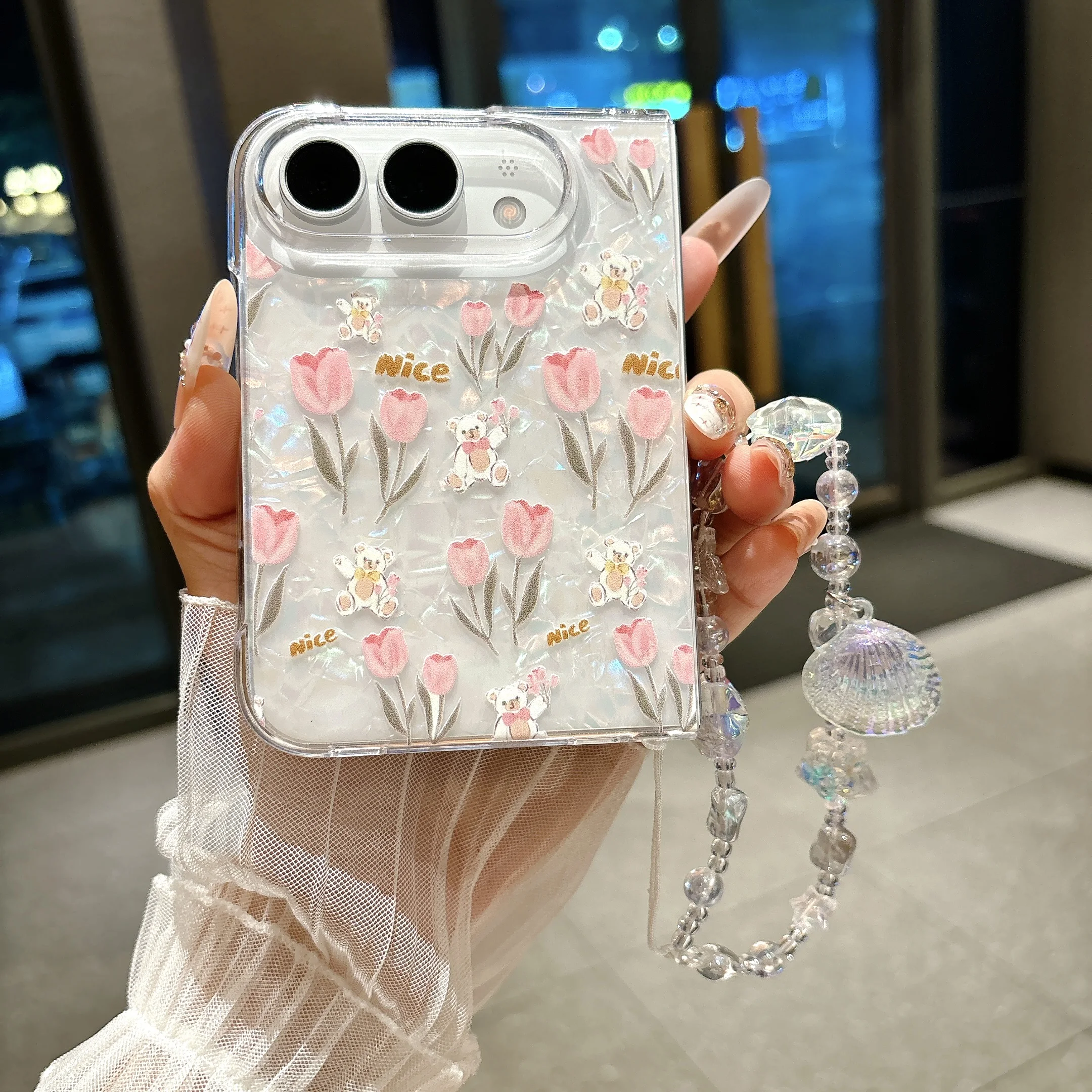 Cute Shell Pattern Flower Bracelet Case‌ for iPhone Ultra 18 Fold Wide Shockproof Lens Protrusion Comfortable Grip Slim Cover