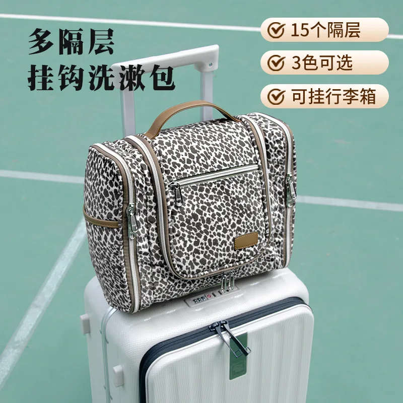 Large-capacity, portable hanging toiletry bag with blue and white stripes, designed to be hung on luggage