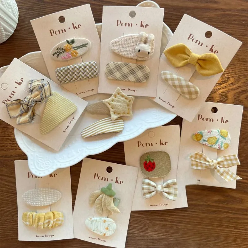 

Korean new cream-colored fabric girls' hair accessories: Bow, plaid & solid BB clips—soft, hair-friendly, gentle & versatile
