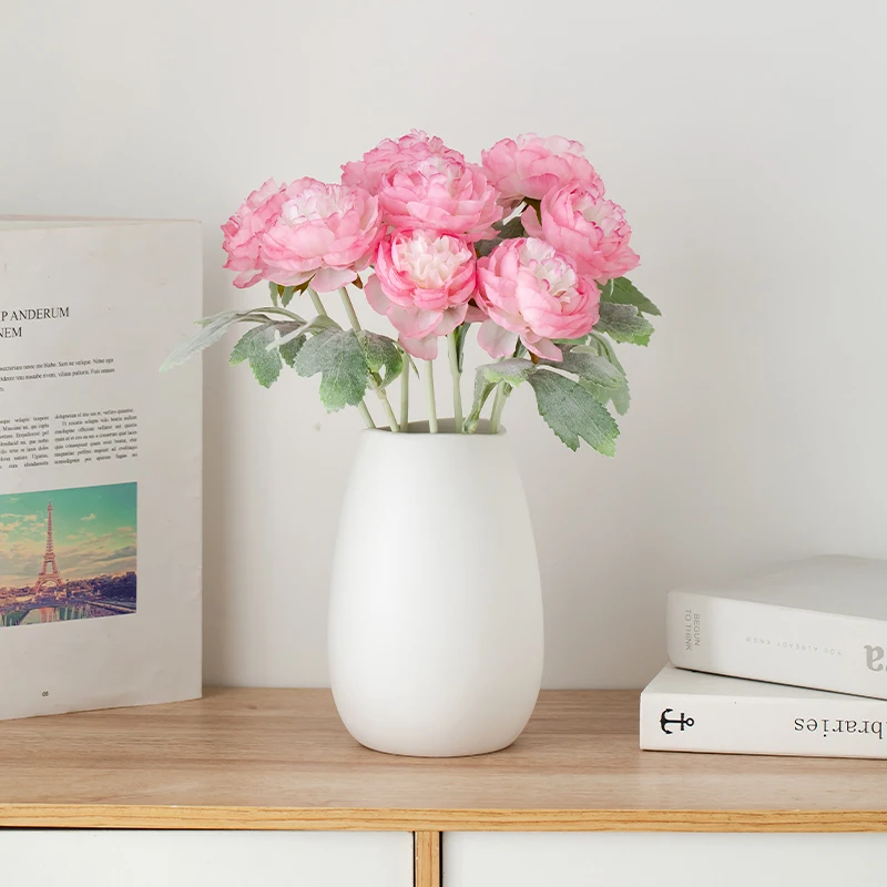 

Simple white ceramic vase decoration for home flower arrangement, exuding a luxurious and sophisticated vibe. Perfect for calmin