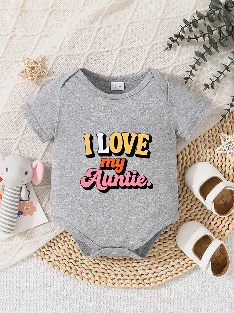 

Playful letter-printed baby short-sleeve triangle bodysuit. Button closure for easy dressing, machine washable