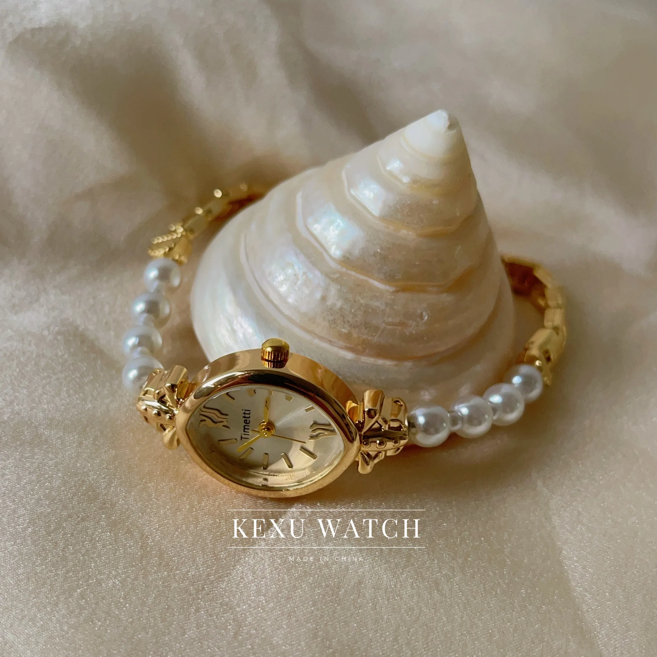 ساعة تيميتي للنساء، ساعة نسائية بسوار من اللؤلؤ مستوحاة من الطراز القديم، ساعة نسائية على الموضة ذات وجه بيضاوي للبيع بالجملة