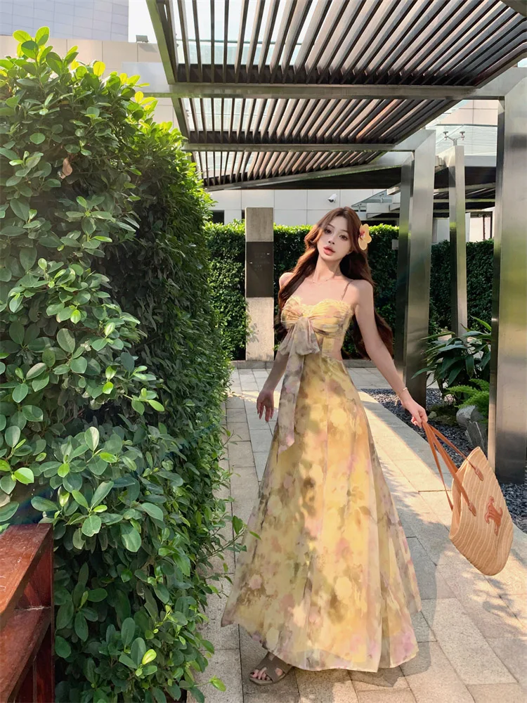 Damska letnia spódnica maxi z wysokim stanem, wyszczuplająca, w stylu koreańskim, z kwiatowym nadrukiem, o kroju litery A, idealna na co dzień i do pracy, kolekcja lato 2025.