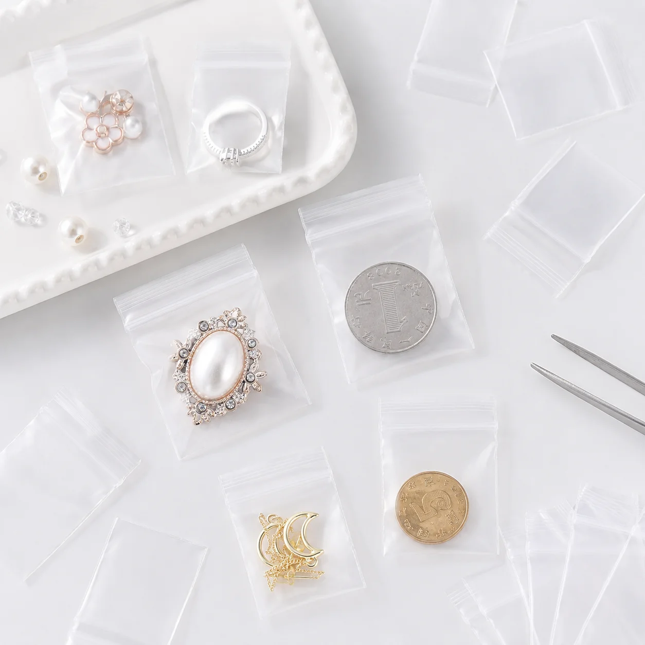 100 Stück Transparente Kleine Zip-Beutel Wiederverschließbare Polyethylen-Plastiktüten zur Aufbewahrung von Schmuck, Accessoires, Perlen und Handarbeiten – Detail 7