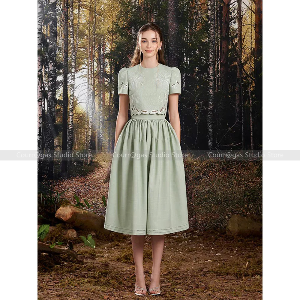 

Vietnam niche light luxury 2024 new green skeleton short sleeve + pressed pleated half-body skirt long skirt two-piece suit