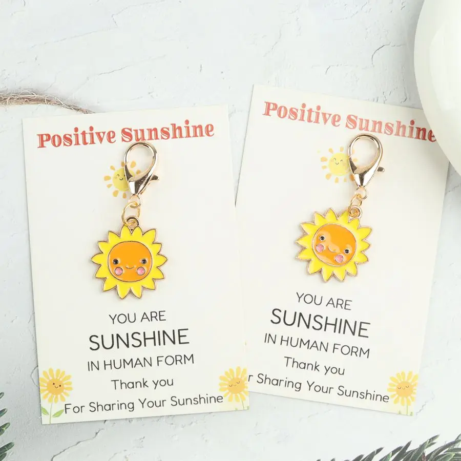 1pc/2pcs cartoon sun keychain. Perfect for giving as a gift to friends and family, comes with a bag clip.