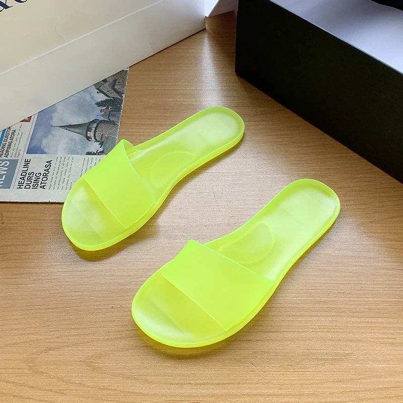 Letnie nowe duże plastikowe buty damskie płaskie jednokolorowe modne okrągłe palce z wystającym palcem wygodne sandały i kapcie damskie